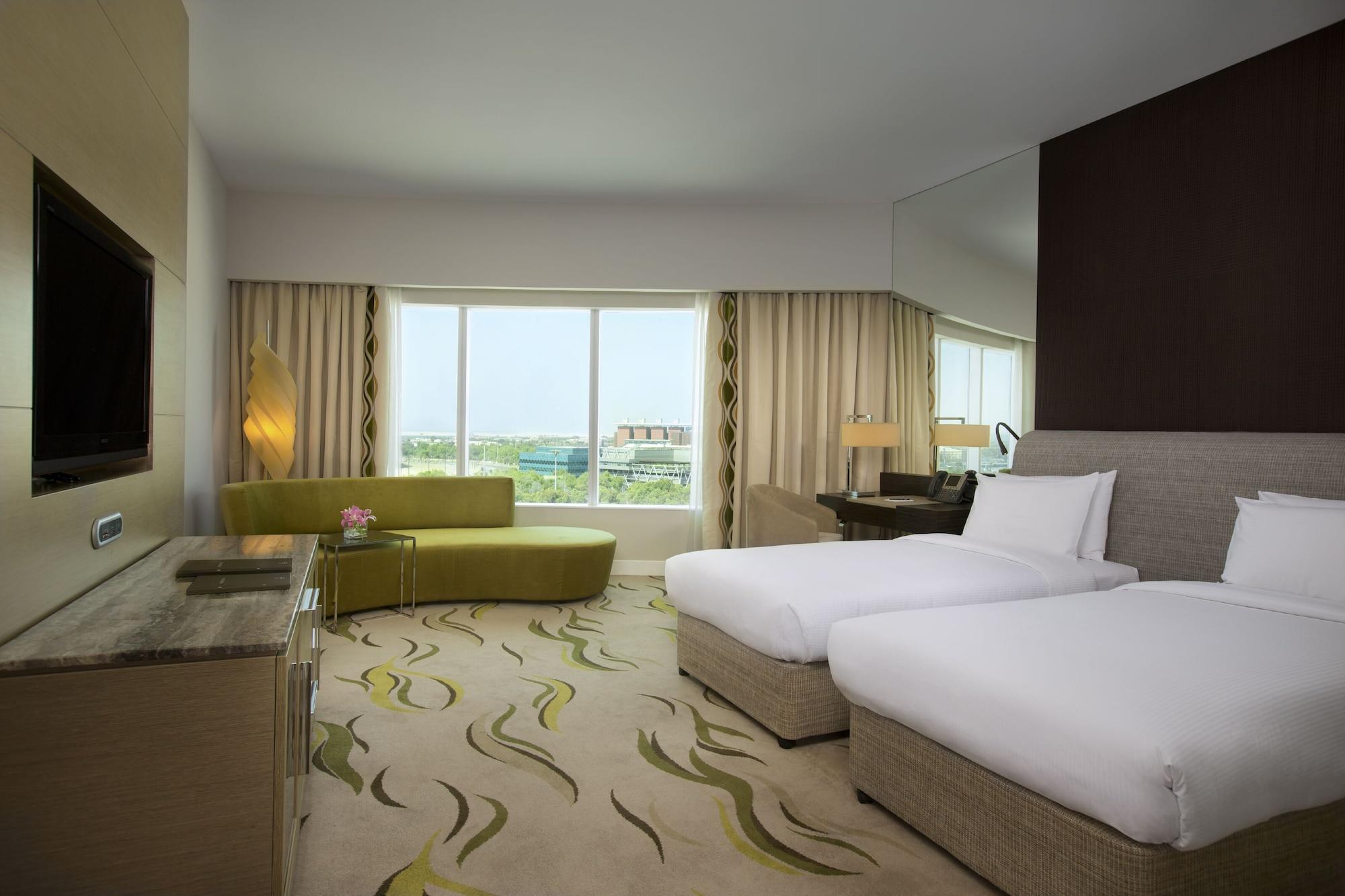 Millennium Al Rawdah Hotel Abu Dhabi Esterno foto A room at the hotel