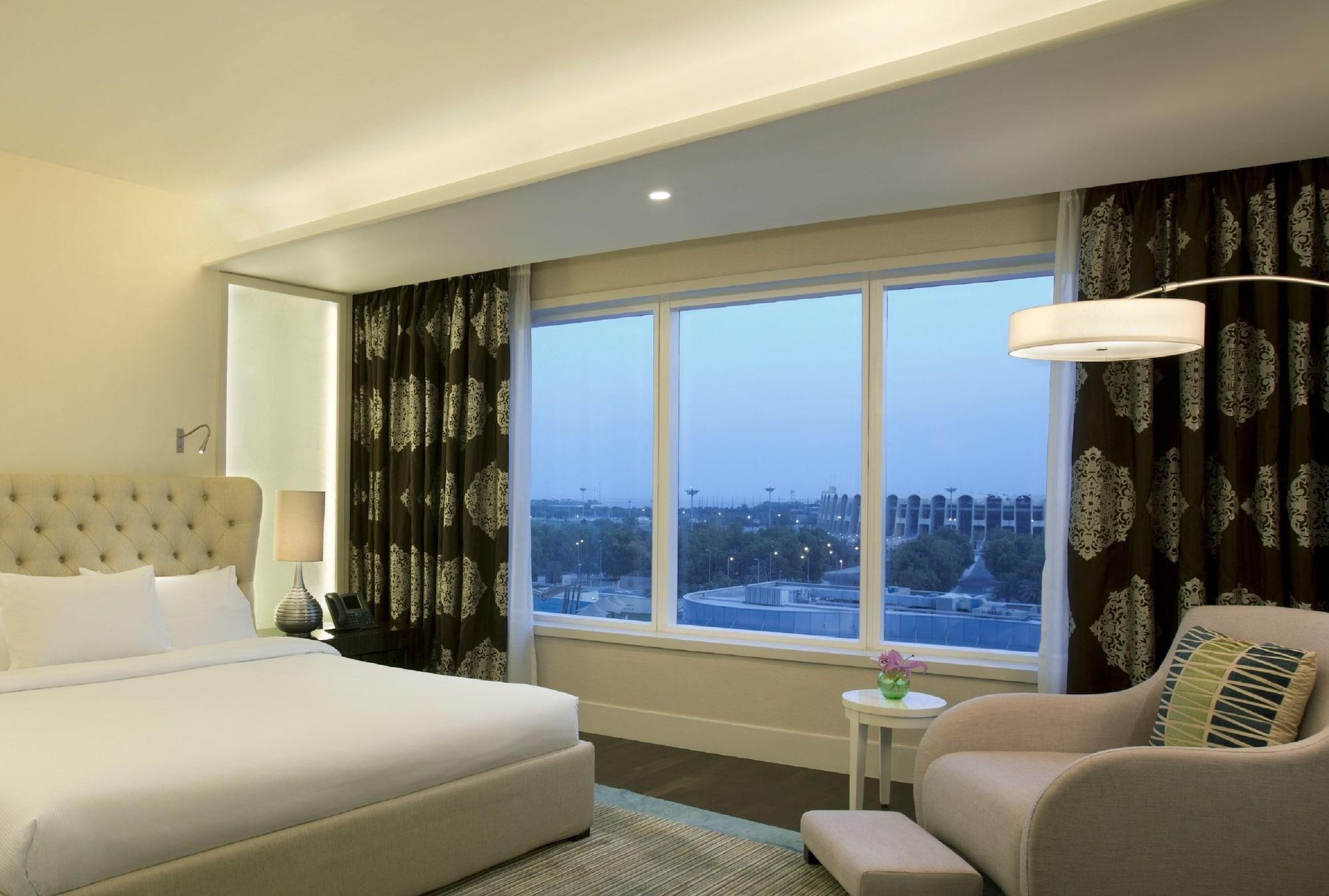 Millennium Al Rawdah Hotel Abu Dhabi Esterno foto A view of the hotel from a guest room