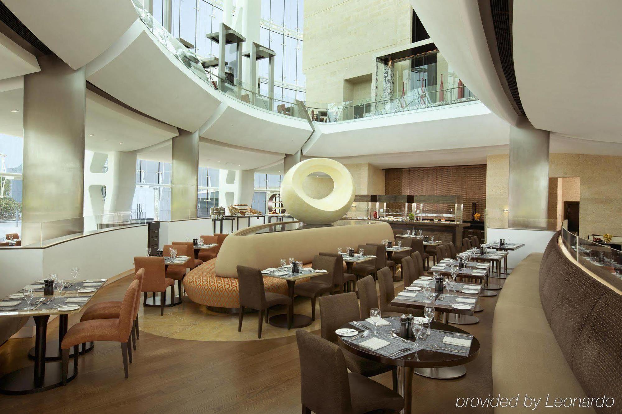 Millennium Al Rawdah Hotel Abu Dhabi Esterno foto The restaurant