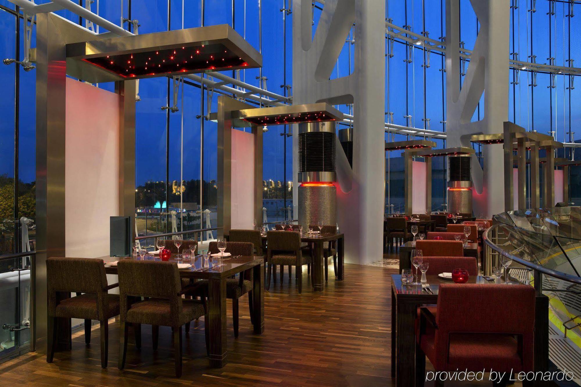 Millennium Al Rawdah Hotel Abu Dhabi Esterno foto The interior of the restaurant